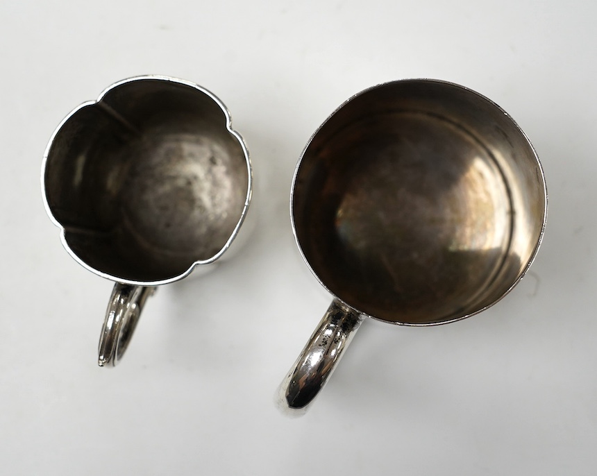 A George V silver mug, by Walker & Hall, Sheffield, 1936, 88mm, together with an earlier silver christening mug, 10.1oz. Condition - fair